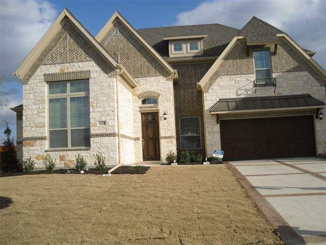 View of front of home featuring a garage and a front lawn at 4688 Cheetah Trail, Frisco, TX 75034