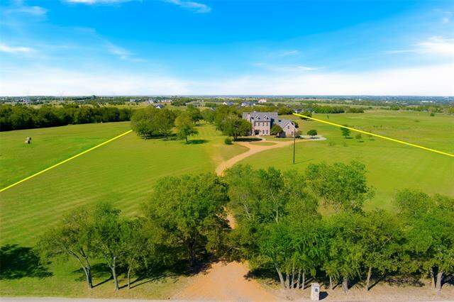 Experience breathtaking views from this stunning 12.6 acre property, perched on one of the highest points in Collin County. Additional acreage available. at 6268 Cr 177, Celina, TX 75009