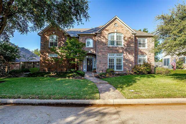 Elegant front elevation and WOW landscaping! at 8120 Sundale Court, Fort Worth, TX 76123