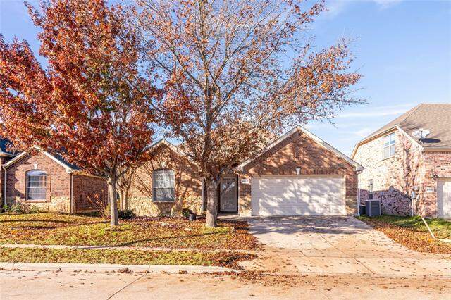 View of front of property featuring a garage and cooling unit at 10017 Daly Drive, Fort Worth, TX 76053
