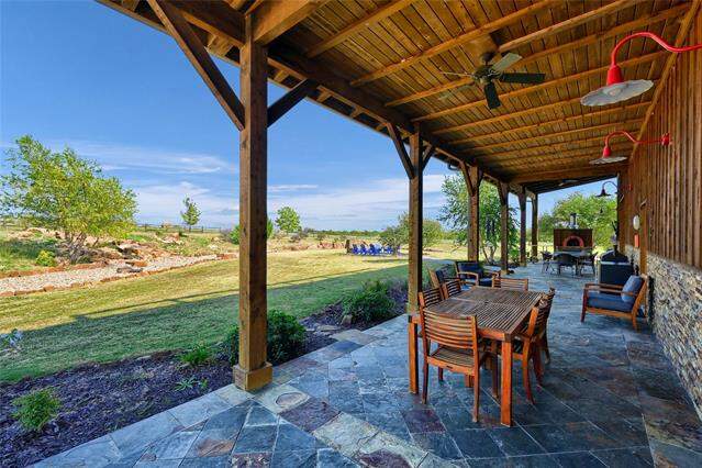 View of patio / terrace featuring outdoor dining space and a ceiling fan at 5555 County Road 179, Celina, TX 75009