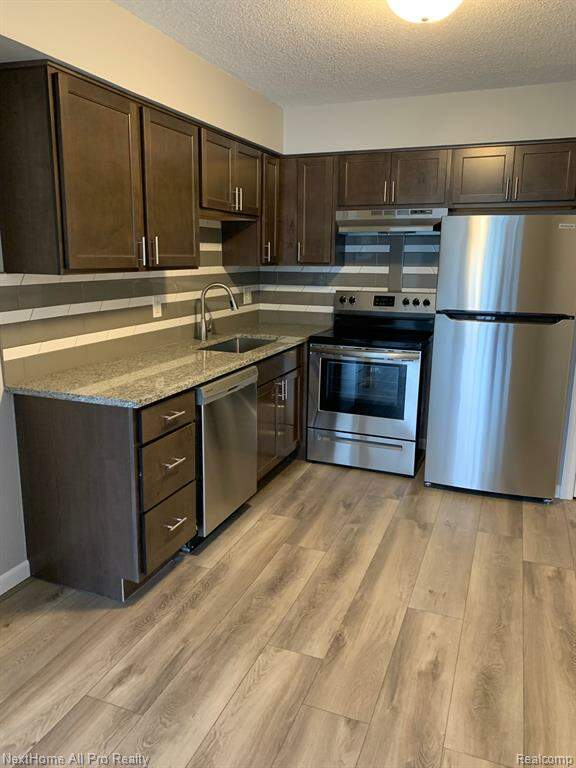 1252 E West Maple Road 8, Walled Lake, MI 48390 MLS 20230030206